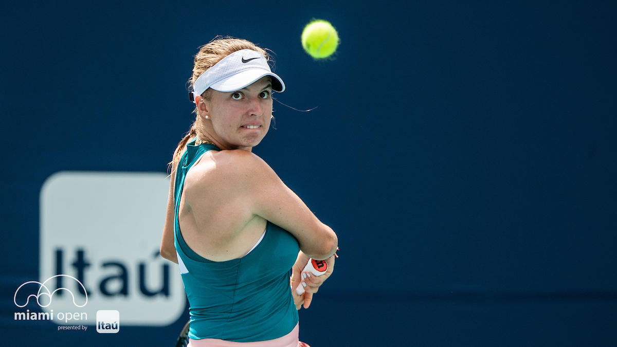 female player about to hit backhand