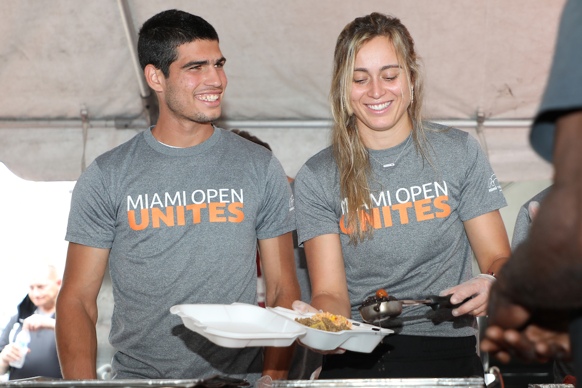 players serving food for miami open unites
