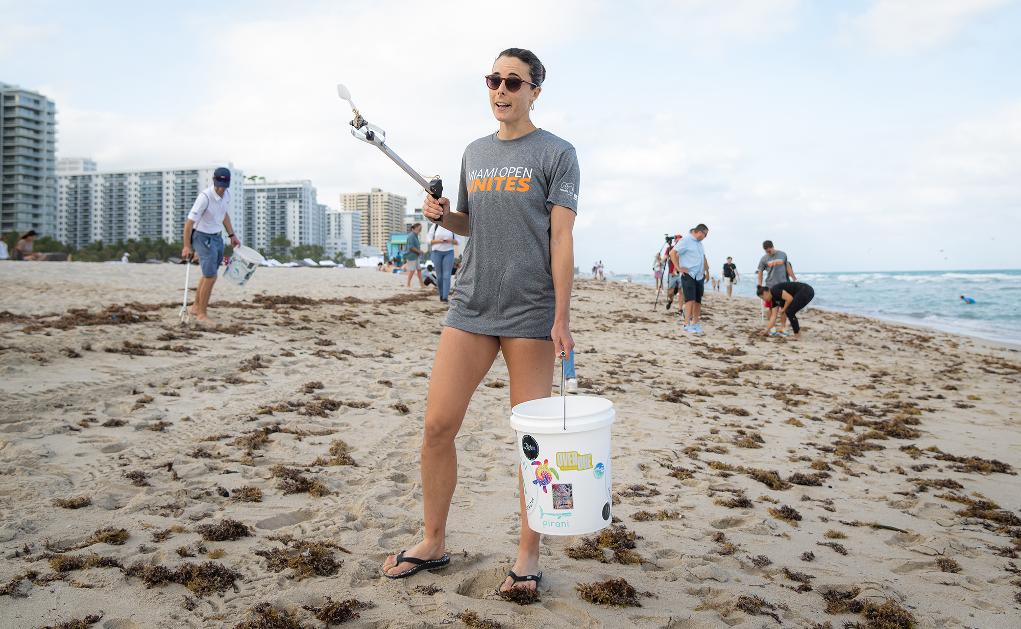 Alize Cornet of France helps Clean Miami Beach as part of Miami Open Unites