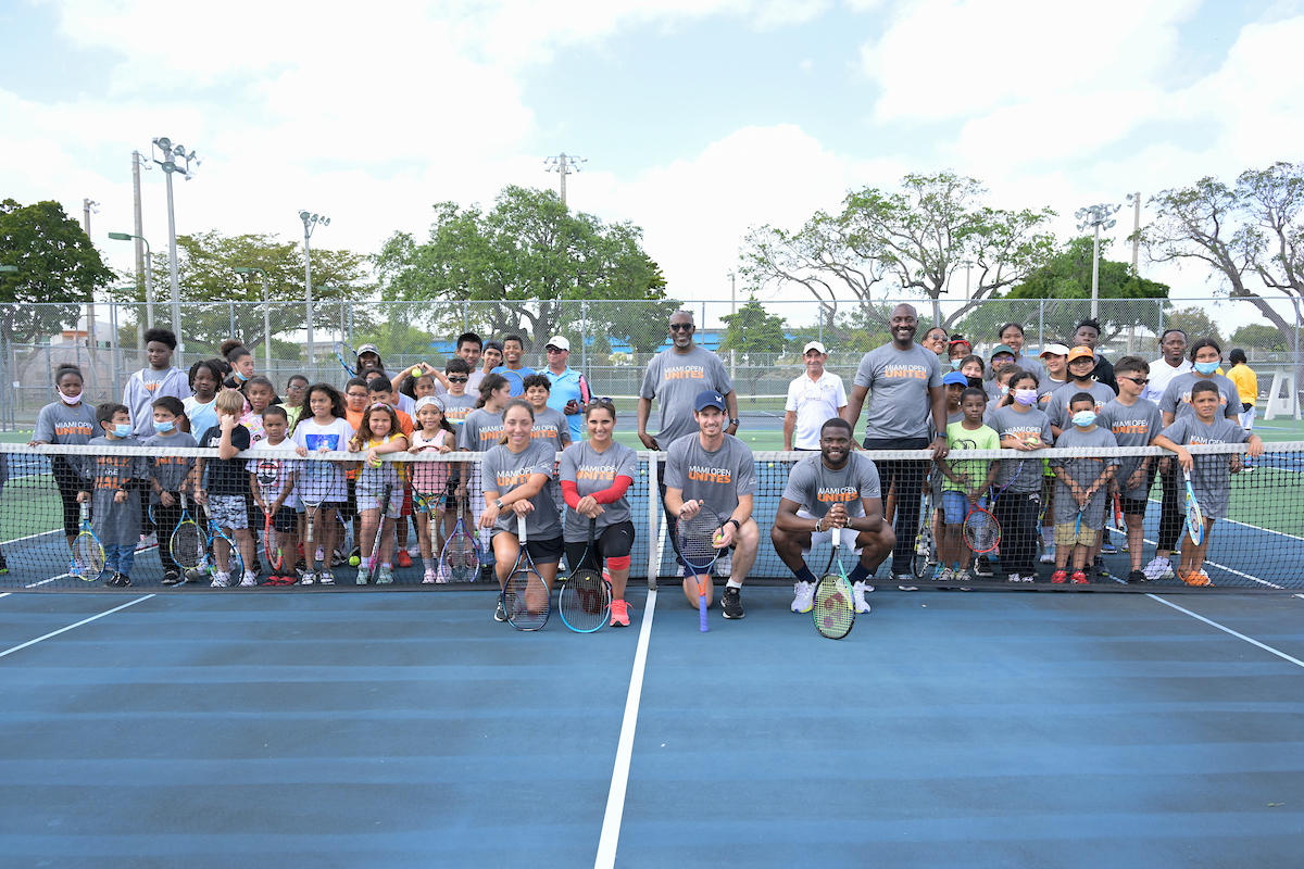 group photo at kids clinic for miami open unites