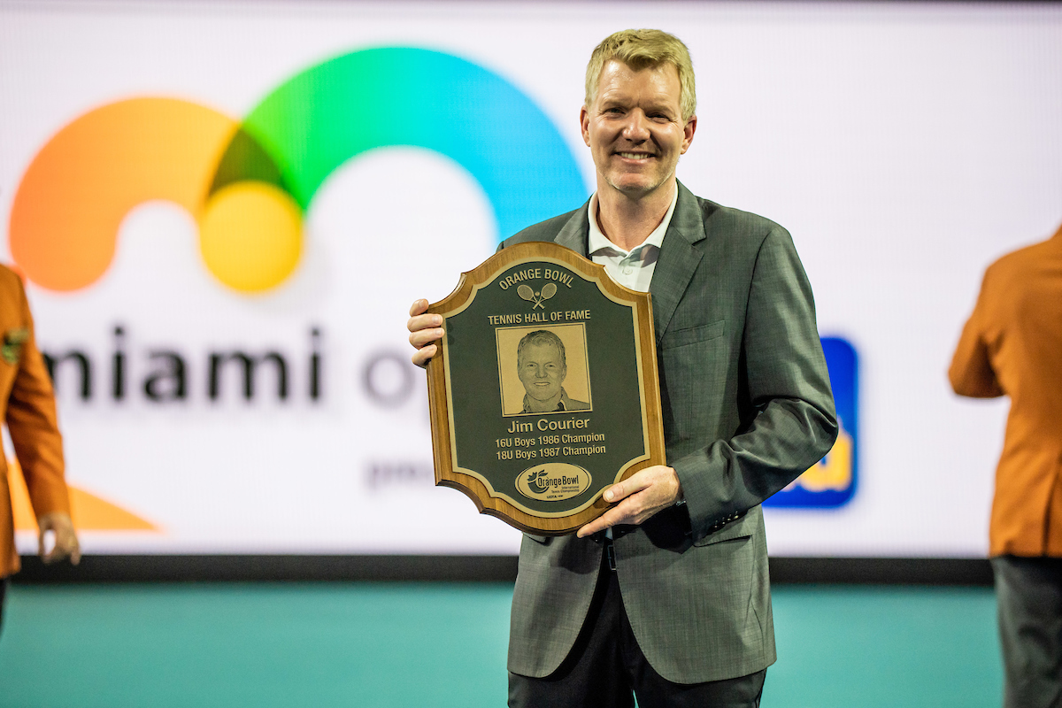 Jim Courier holding plaque at Orange Bowl Hall of Fame Presentation