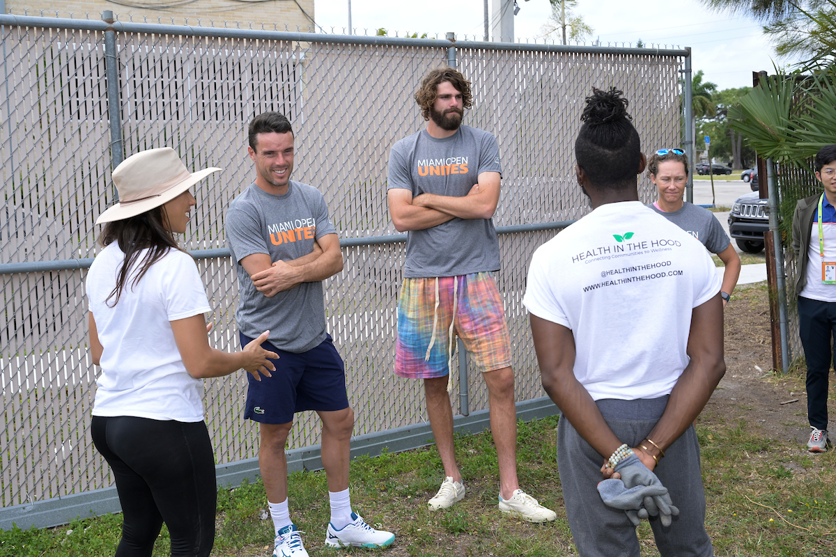 Roberto Bautista Agut of Spain, Samantha Stosur of Australia and Reilly Opelka of United States at community garden for health in the hood
