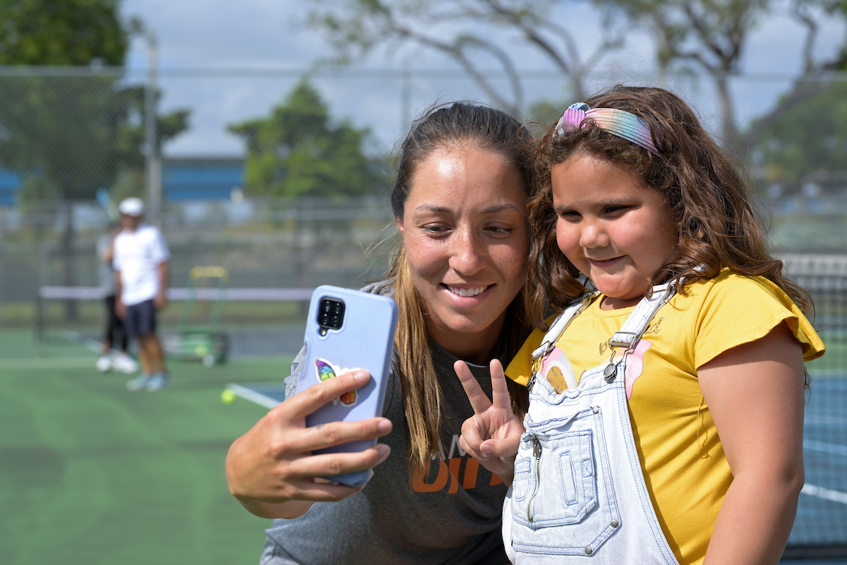 Jessica Pegula of USA takes selfie with young fan attending the Miami Open