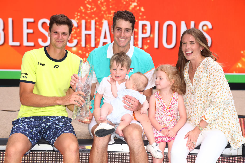 John Isner poses for a photo with his family
