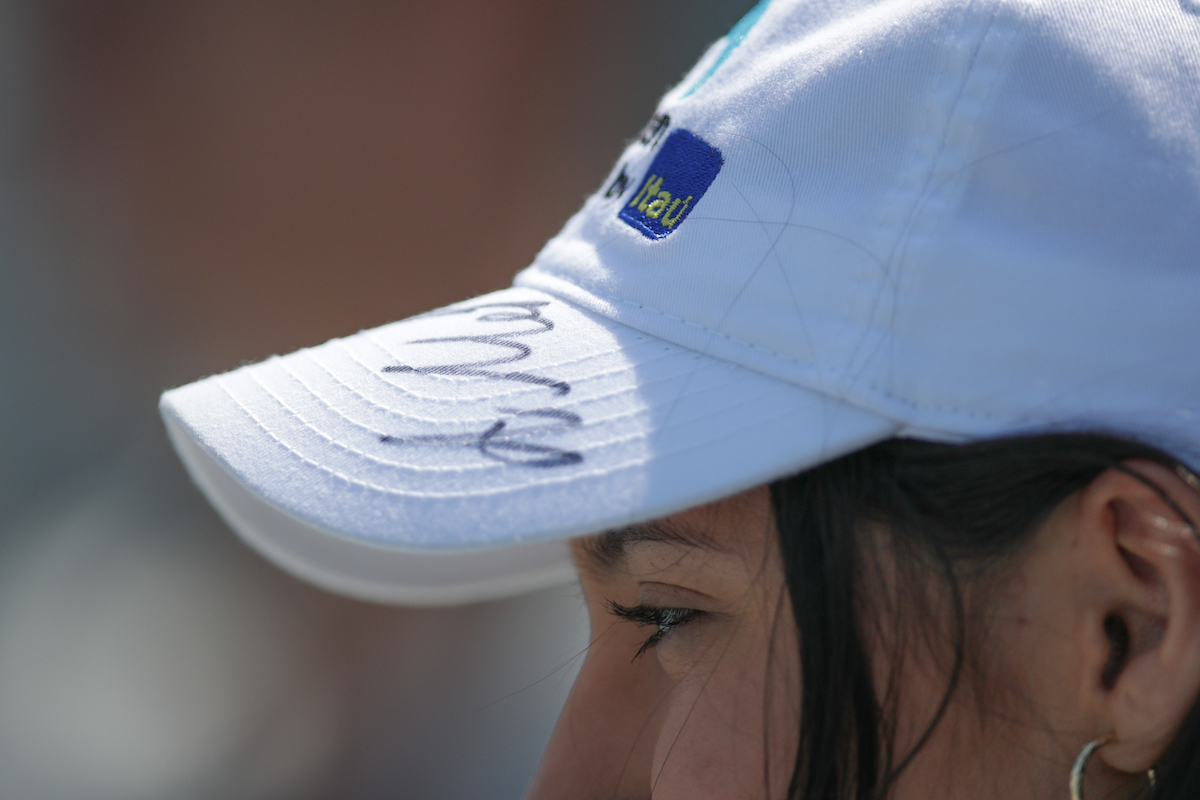 Attendee with autographed cap