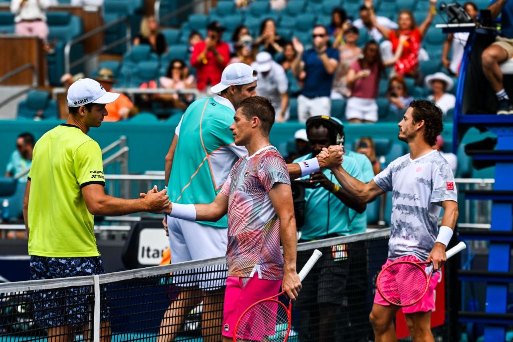 Hubert Hurkacz, John Isner, Neal Skupski, and Wesley Koolhof, shake hands at net after the mens double finals at the 2022 Miami Open