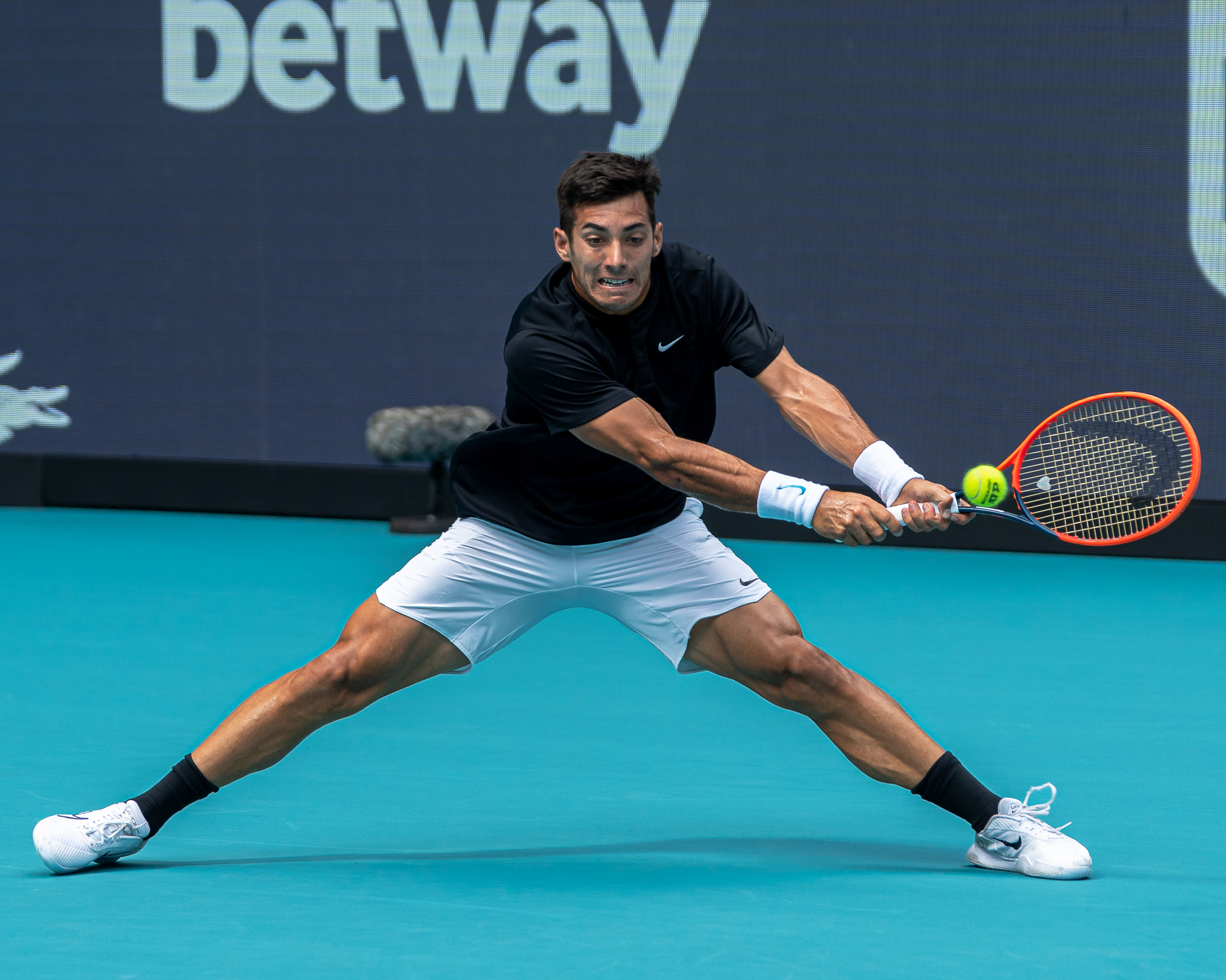 Cristian Garin stretches for a backhand at the Miami Open