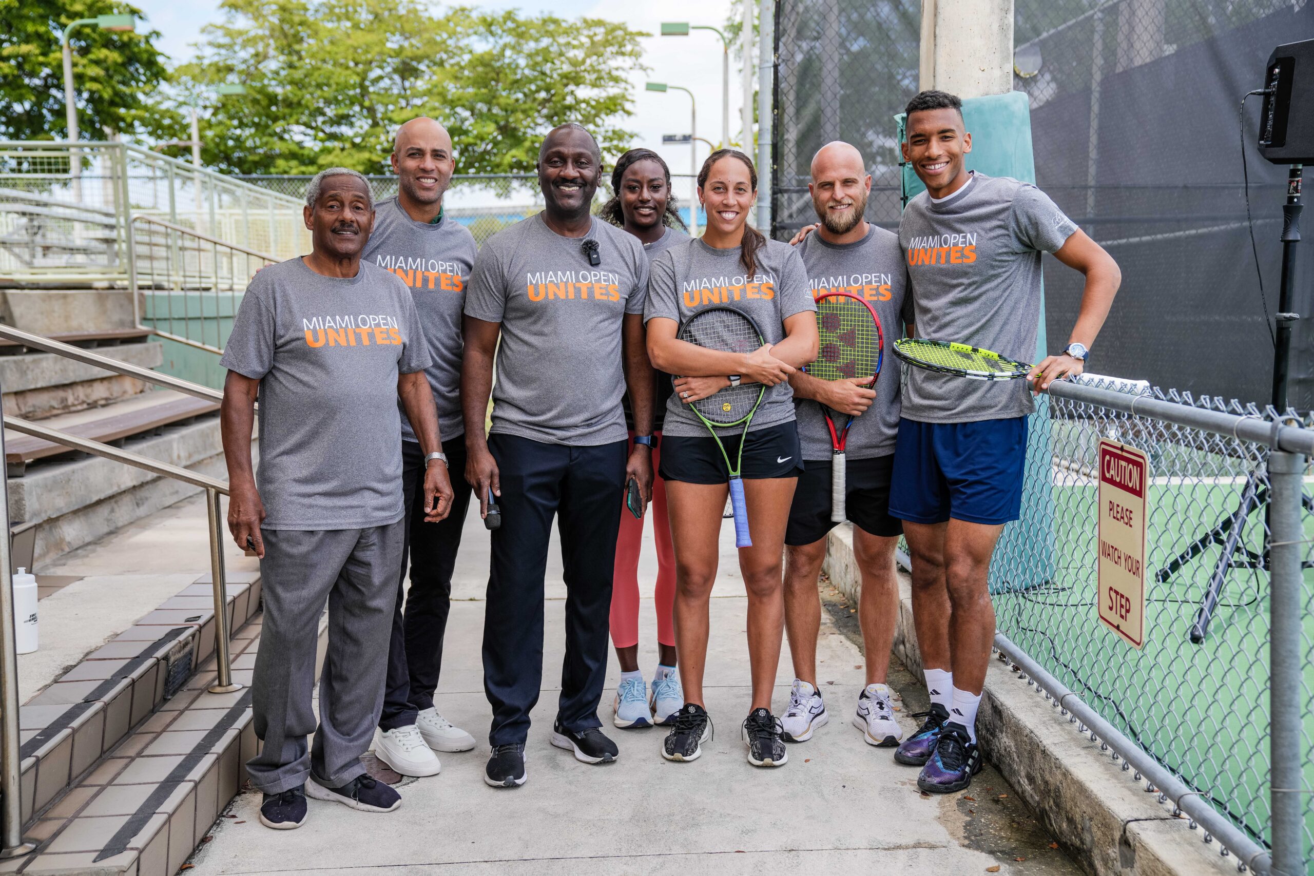 Miami Open Tournament Director James Blake, Alycia Parks, Madison Keys, Denis Kudla, and Felix Auger-Aliassime along gentlemen from Moore Park in Miami during the Big Brothers, Big Sisters event on March 20, 2023.