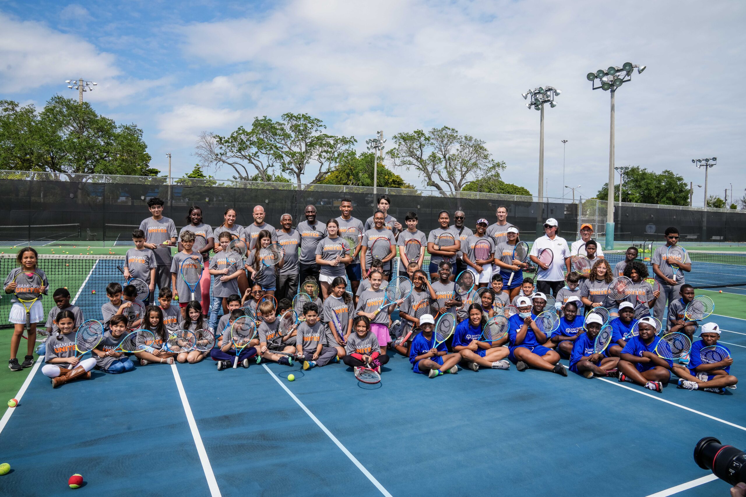 All participants gathered for a group photo at the Big Brother, Big sister event at Moore Park in Miami on March 20, 2023.