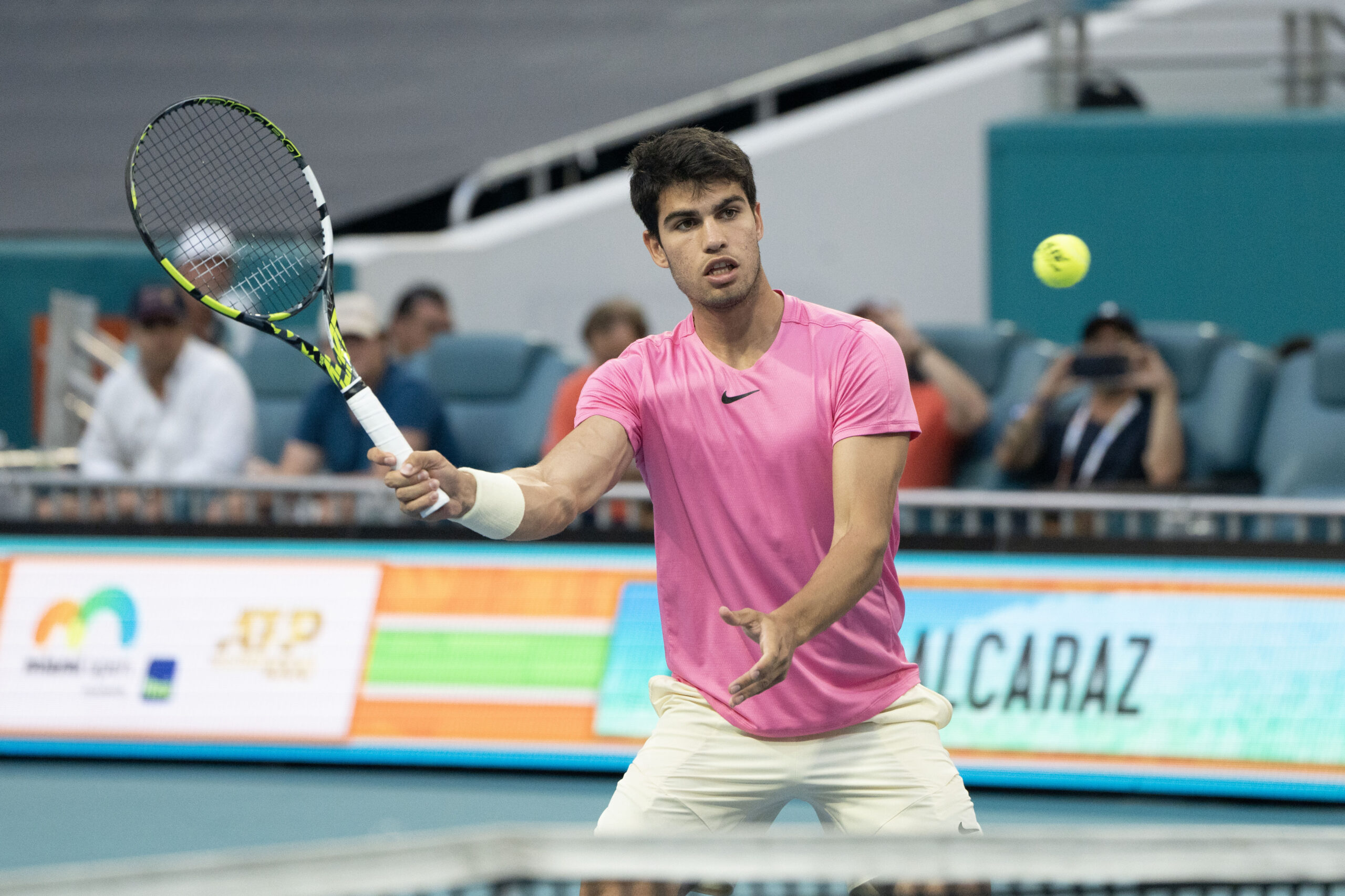 World Number One, Carlos Alcaraz, volleys during his match with Taylor Fritz at the 2023 Miami Open on March 30, 2023 in Miami Gardens, Florida.