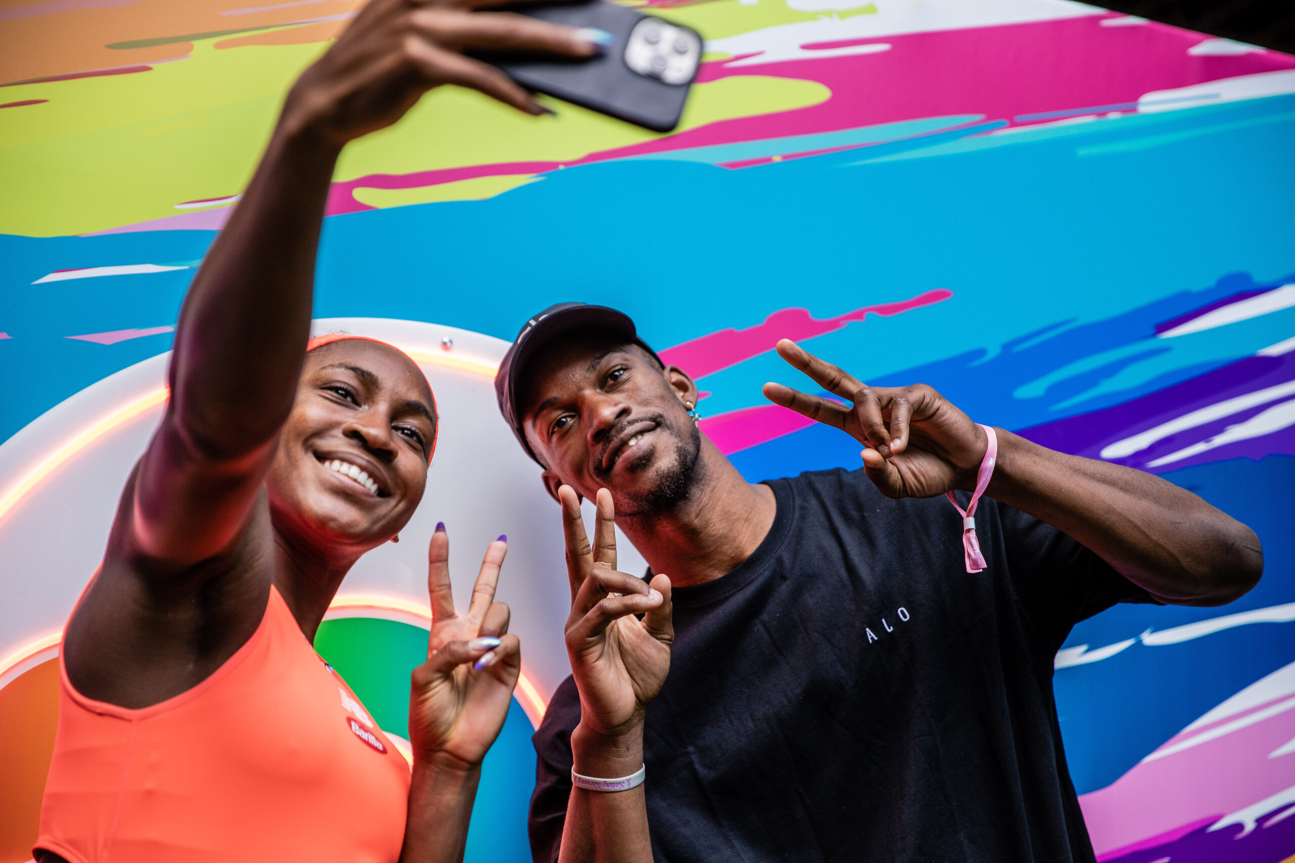 Coco Gauff takes a selfie with Miami Heat player Jimmy Butler during the 2023 Miami Open in Miami Gardens, Fla.