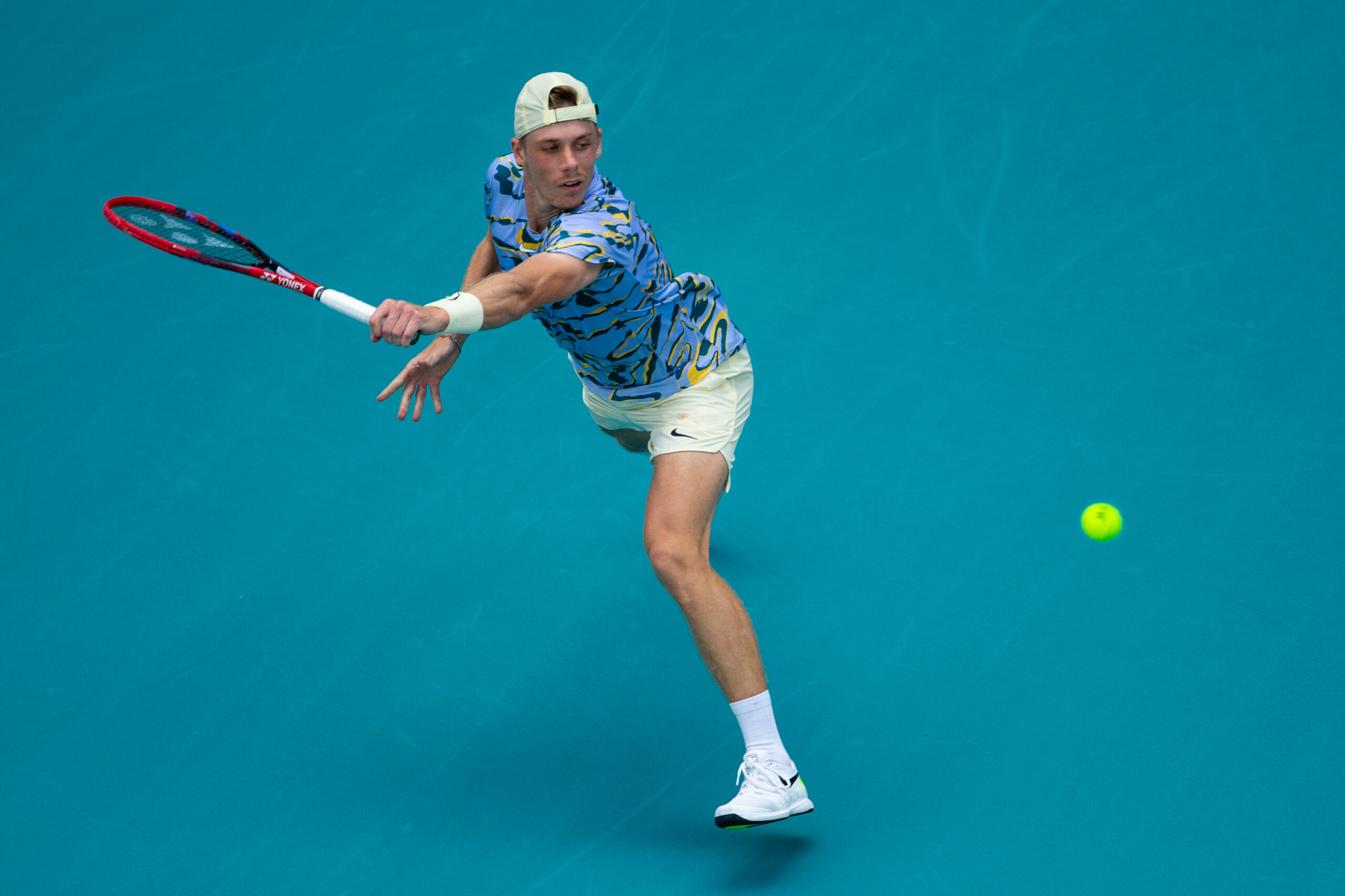 Denis Shapovalov stretches wide during his match against Taylor Fritz at the 2023 Miami Open on March 26