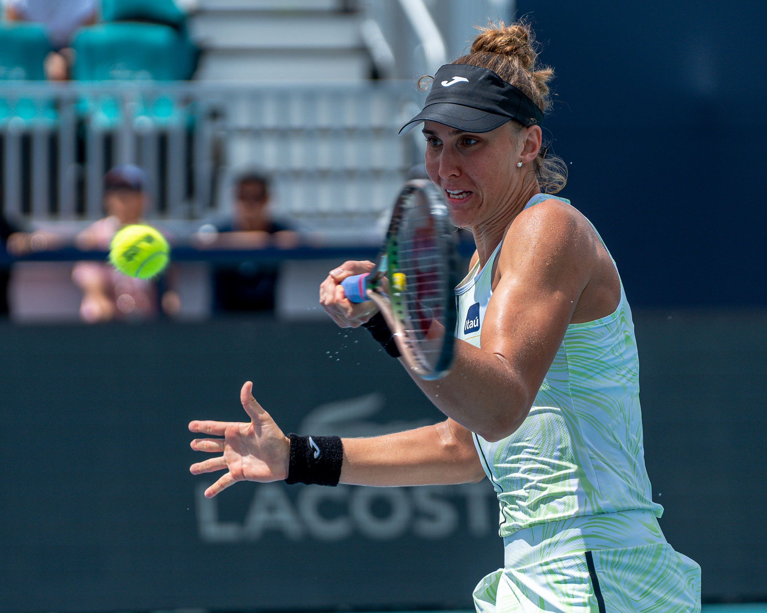 Beatriz Haddad Maia hits a forehand during her match against Jelena Ostapenko at the 2023 Miami Open