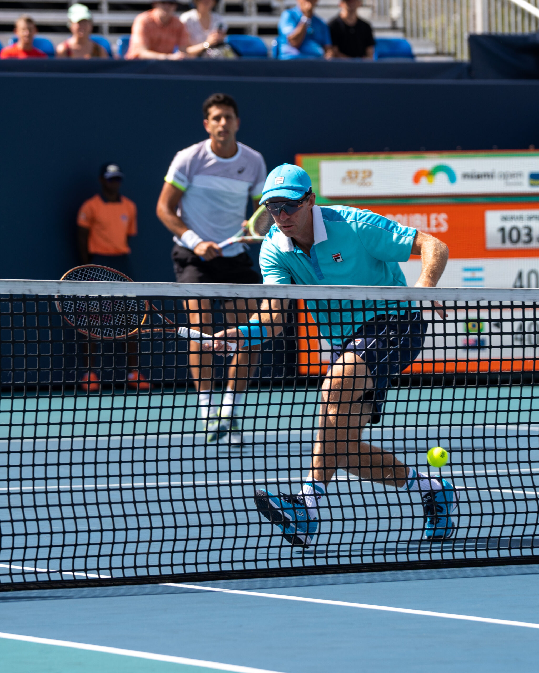 Marcelo Melo and John Peers (volleying) during the 2023 Miami Open in Miami Gardens, Florida.