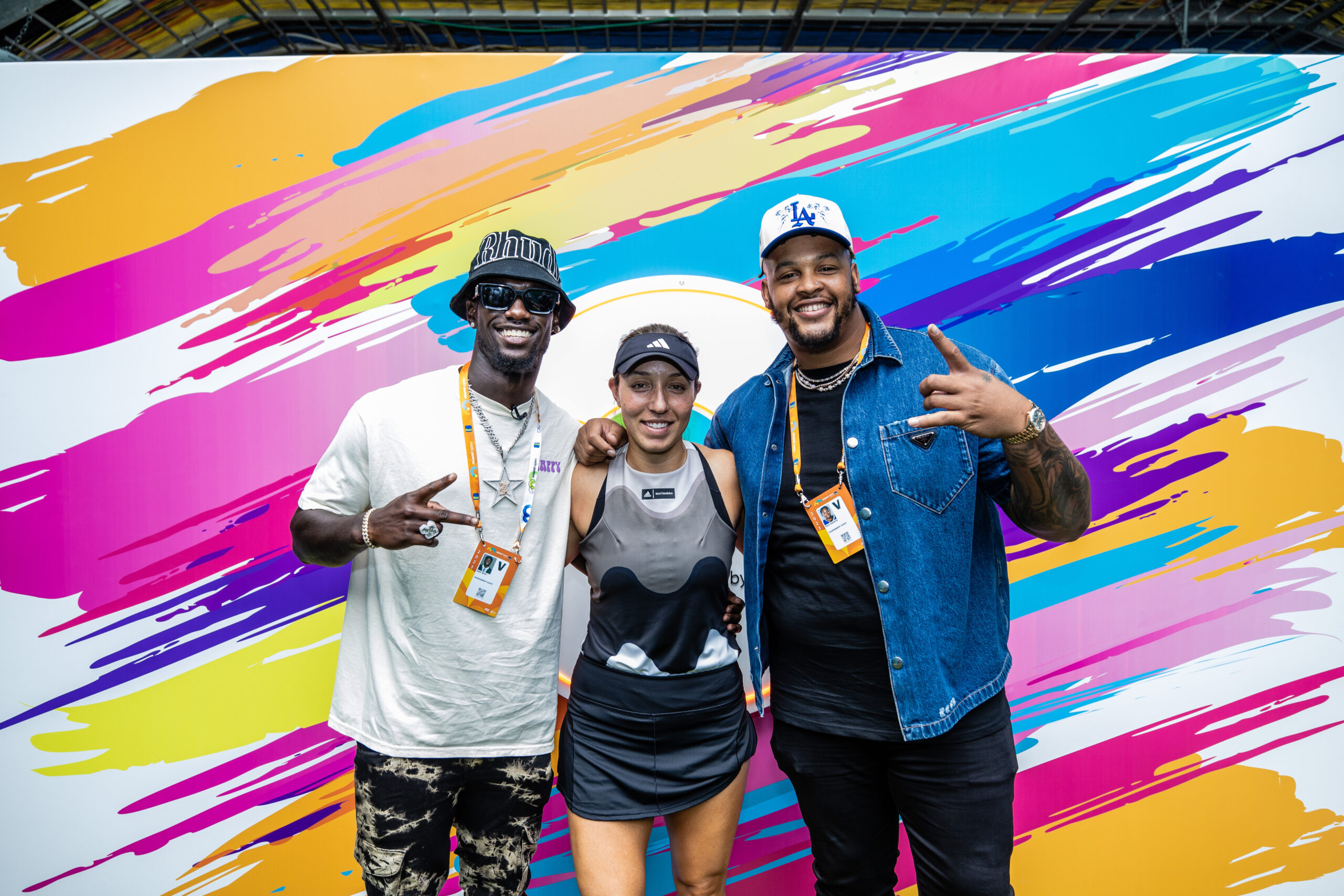 Buffalo Bills players Kaiir Elam (left) and Dion Hawkins with Jessica Pegula at the 2023 Miami Open in Miami Gardens, Fla.
