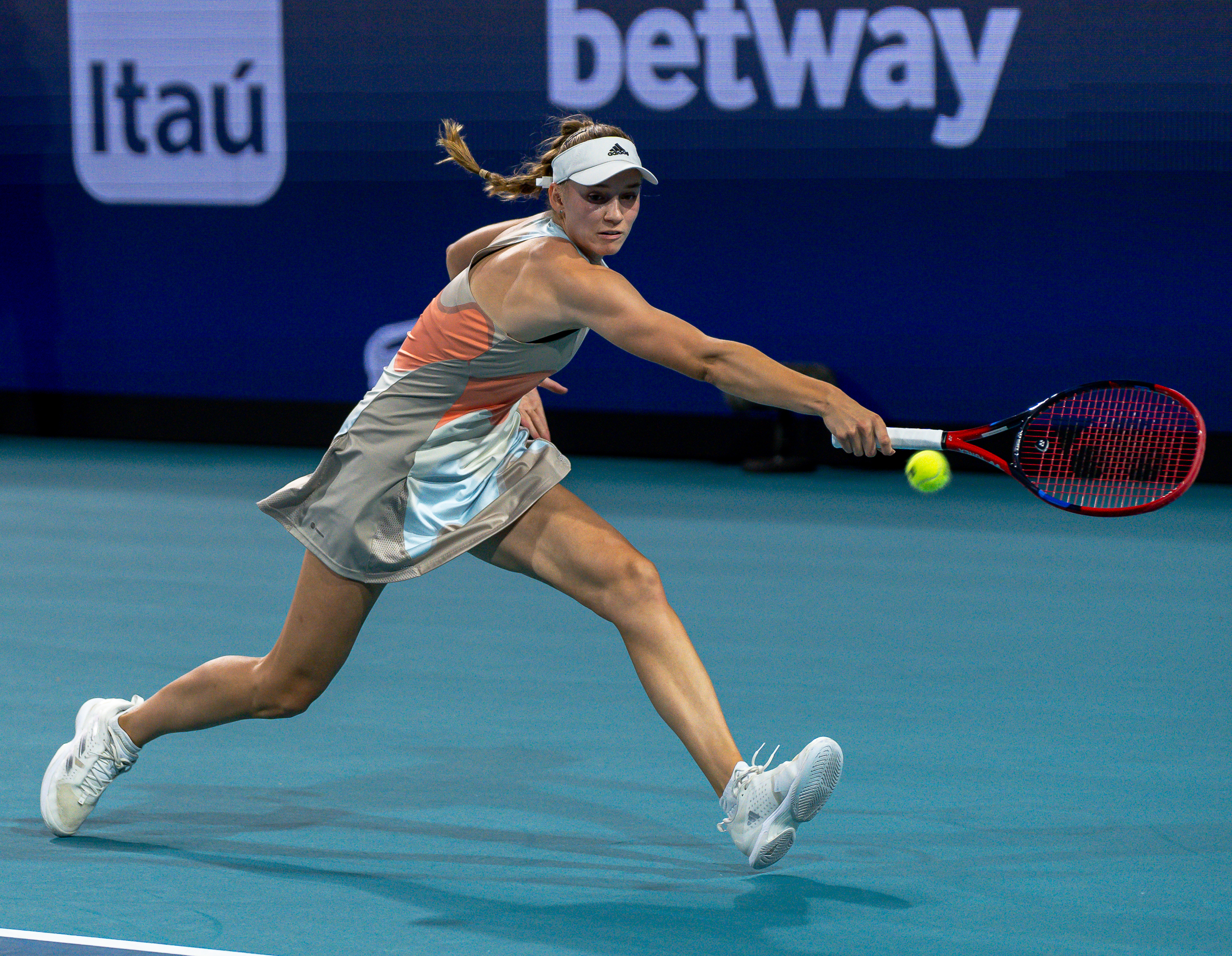 Elena Rybakina stretches for a backhand during her match against Paula Badosa at the 2023 Miami Open on March 25, 2023.