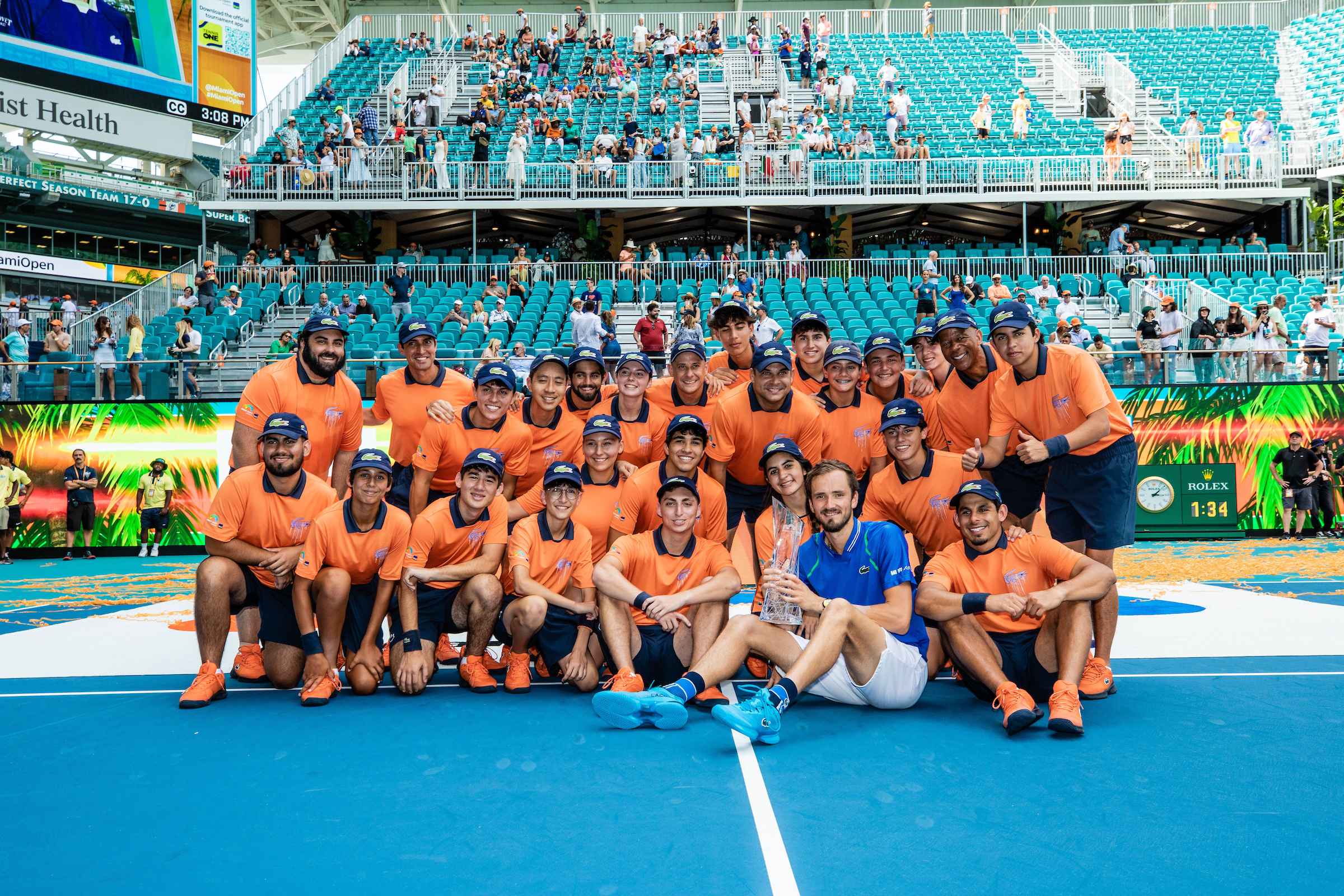 Daniil Medvedev poses with ball persons after winning the 2023 Miami Open Men's Singles Championship at Hard Rock Stadium in Miami Gardens, Florida.