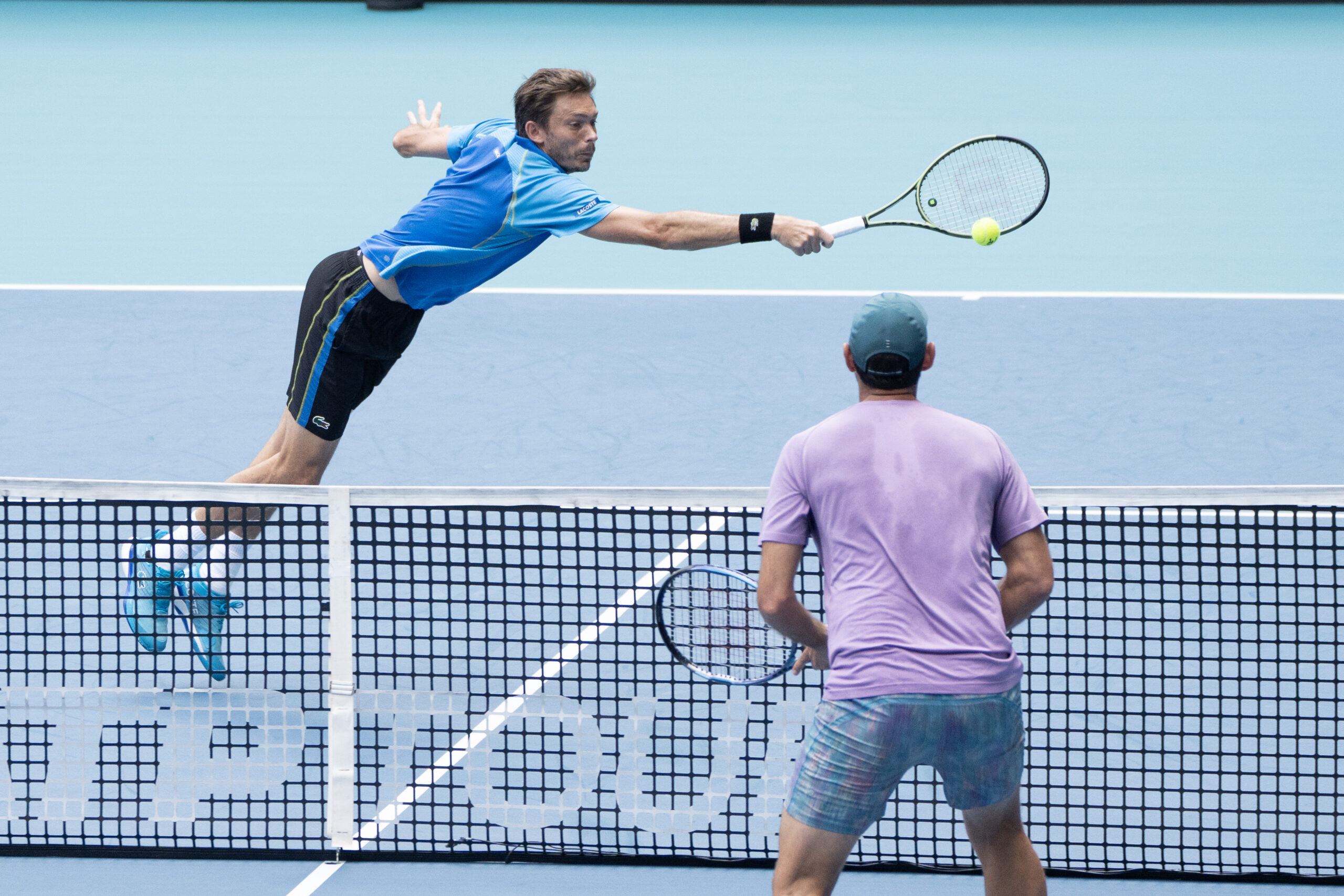 Nicolas Mahut stretches for a wide volley during the 2023 Miami Open Men's Doubles Final at Hard Rock Stadium in Miami Gardens, Florida on April 1st, 2023.
