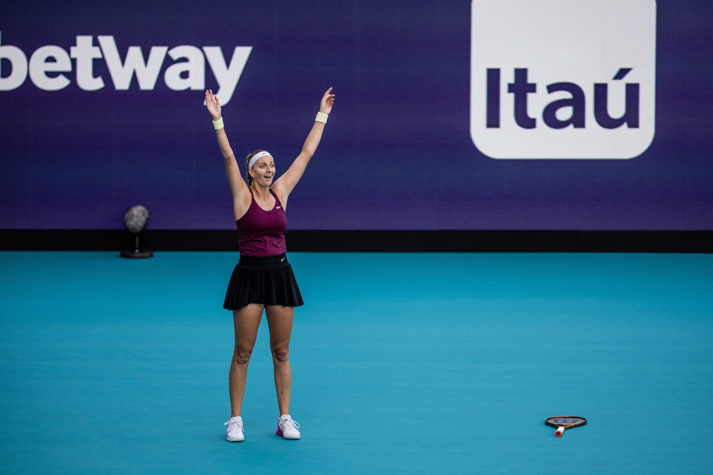 Petra Kvitova raises her arms just after winning the 2023 Miami Open Women's Singles Championship at Hard Rock Stadium in Miami Gardens, Florida.