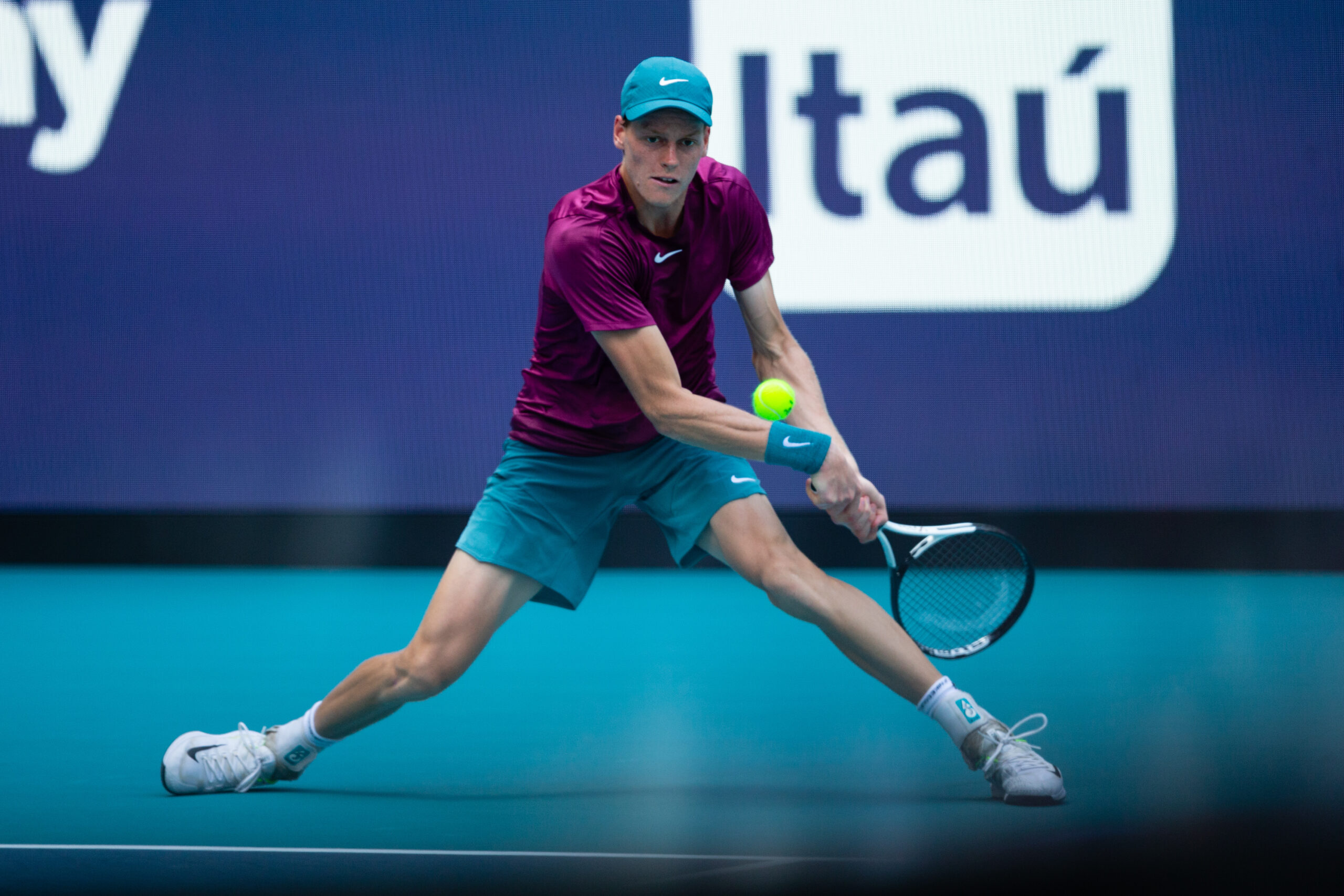 Jannik Sinner gets low for a forehand during the 2023 Miami Open Men's Singles Final at Hard Rock Stadium, April 2, 2023.