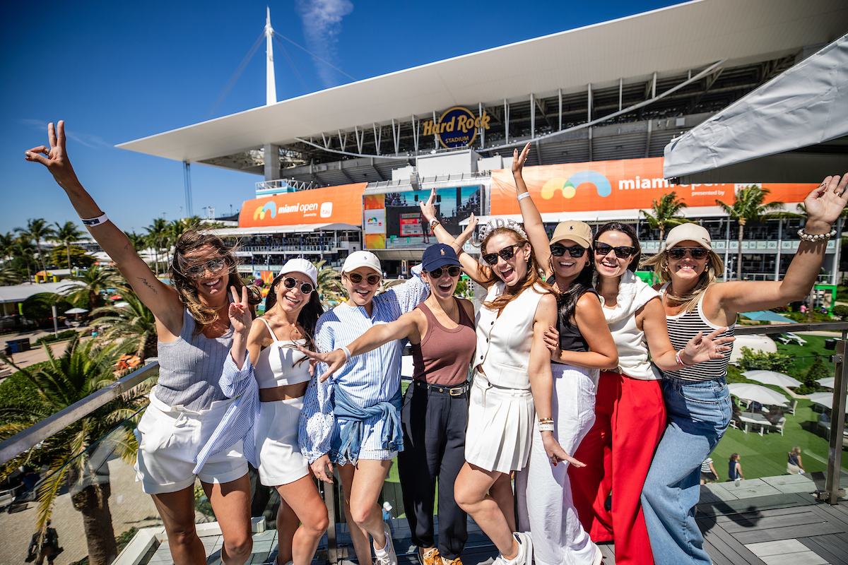 A bachelorette group poses in Kiki on the River in Palm Court during the Miami Open tennis tournament, Thursday, Mar. 20, 2025, in Miami Gardens, Fla.