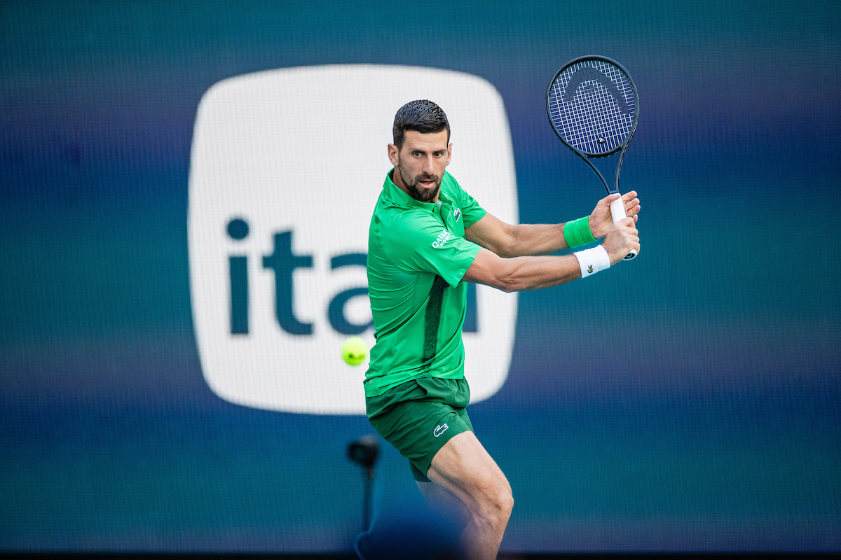 Novak Djokovic of Serbia returns at Hard Rock Stadium court during the Miami Open tennis tournament, Friday, Mar. 21, 2025, in Miami Gardens, Fla.