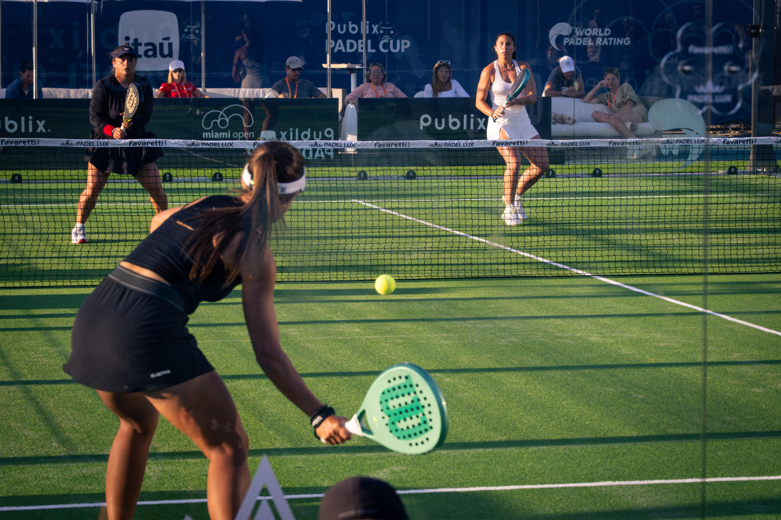 PUBLIX PADEL PARK in this picture, 3 people are playing tennis on the Publix Padel Park