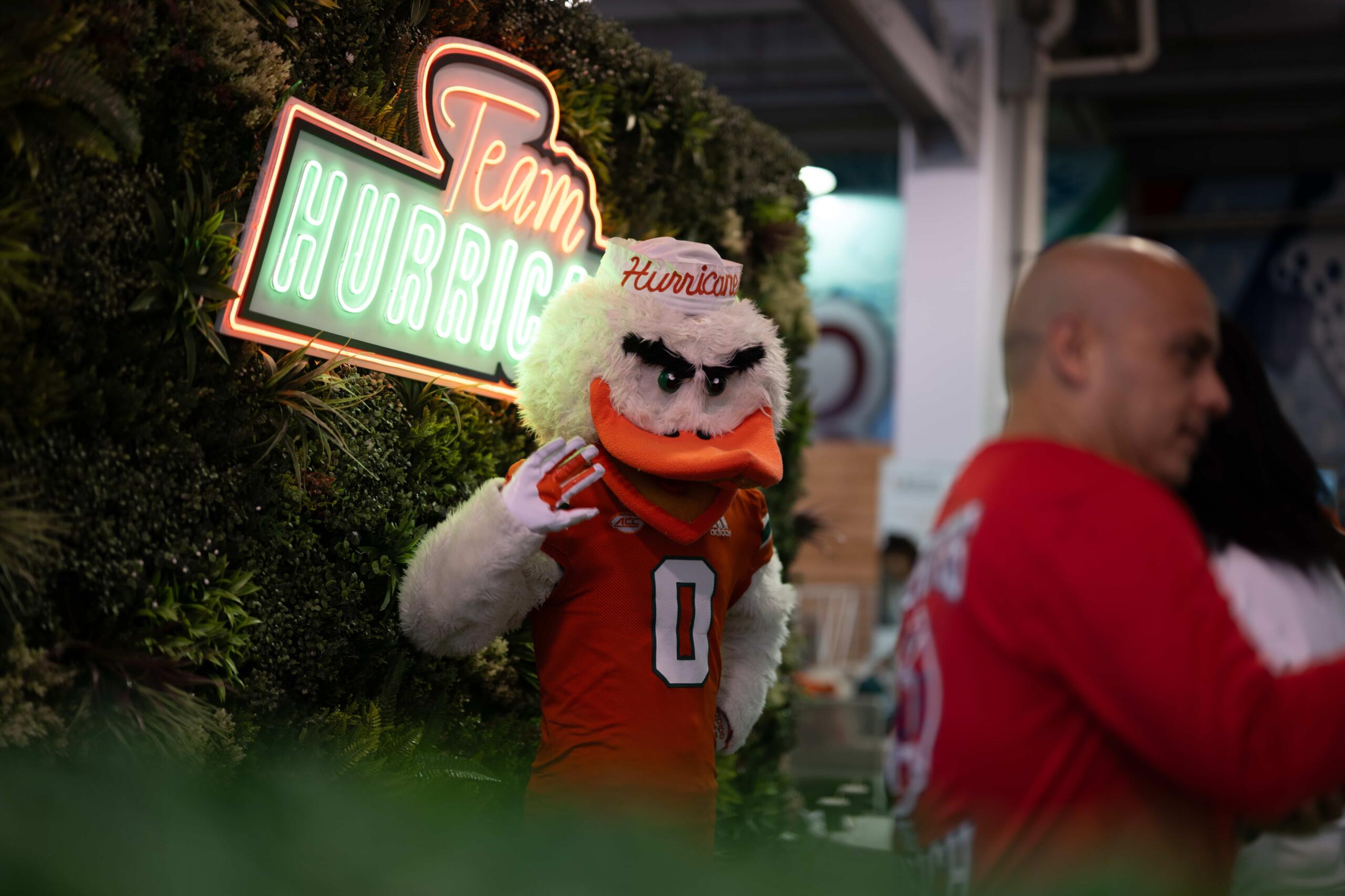 hurricanes mascot poses for picture