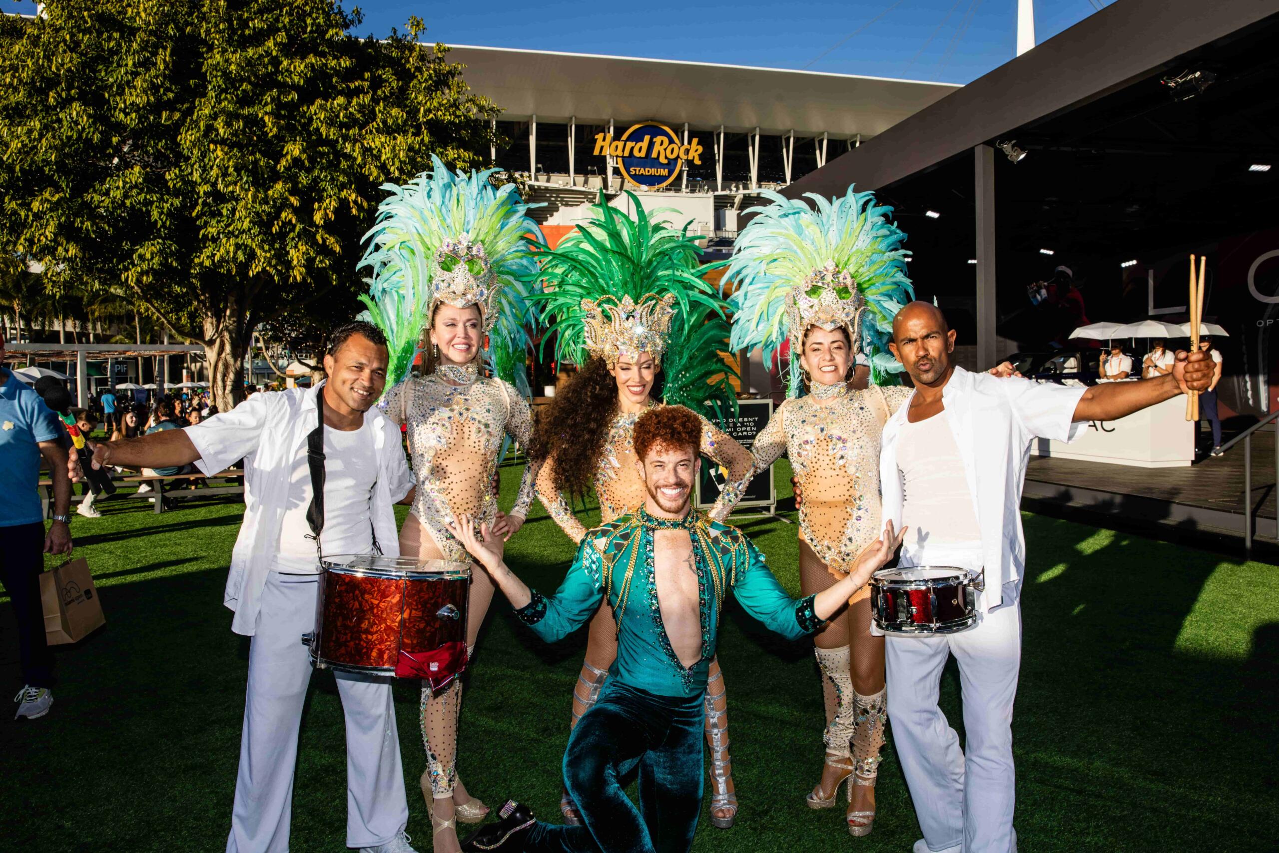 Brazilian dancers pose pose for picture in costumes