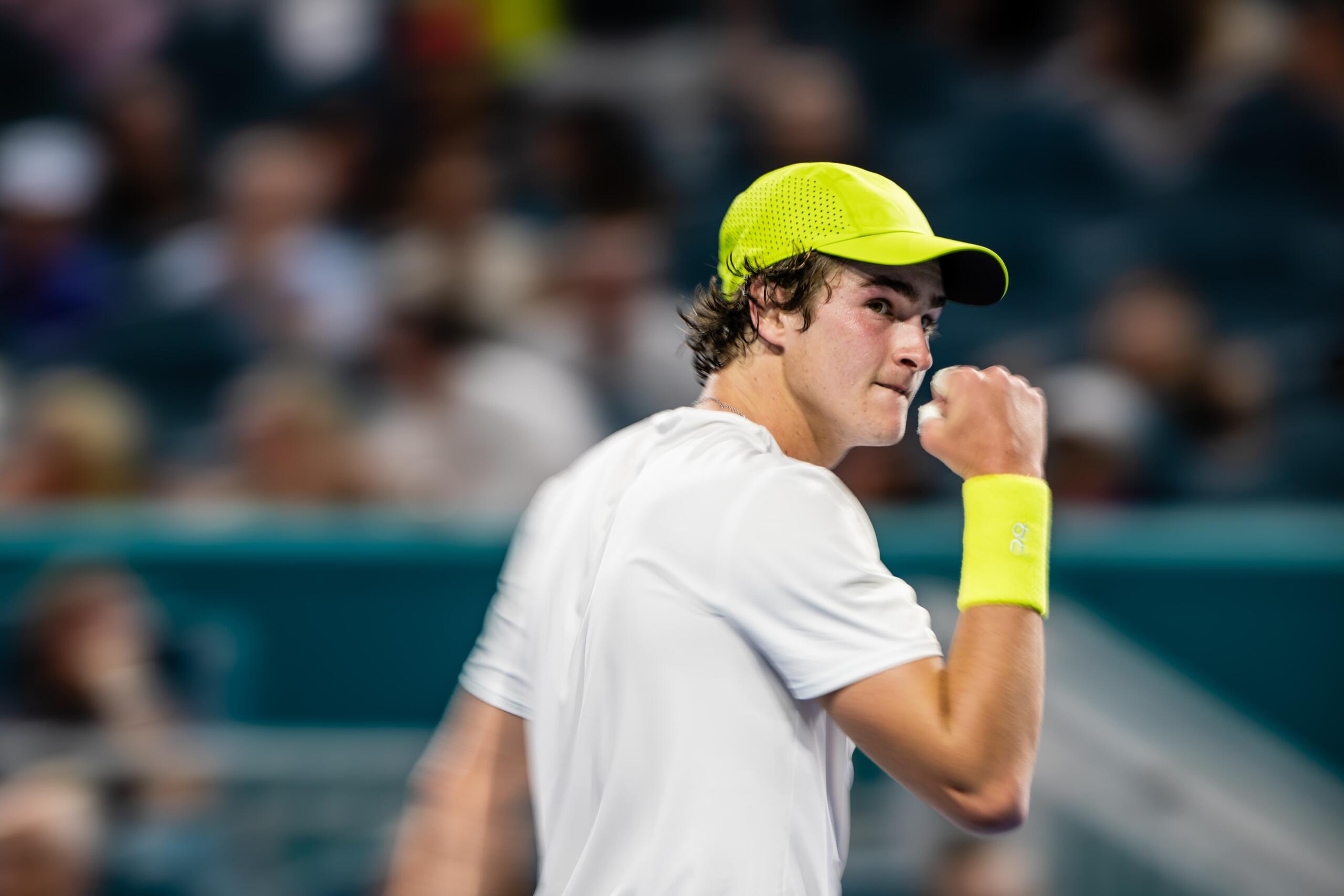 Photo of Joao Fonseca celebrating a point in the court with his fist up