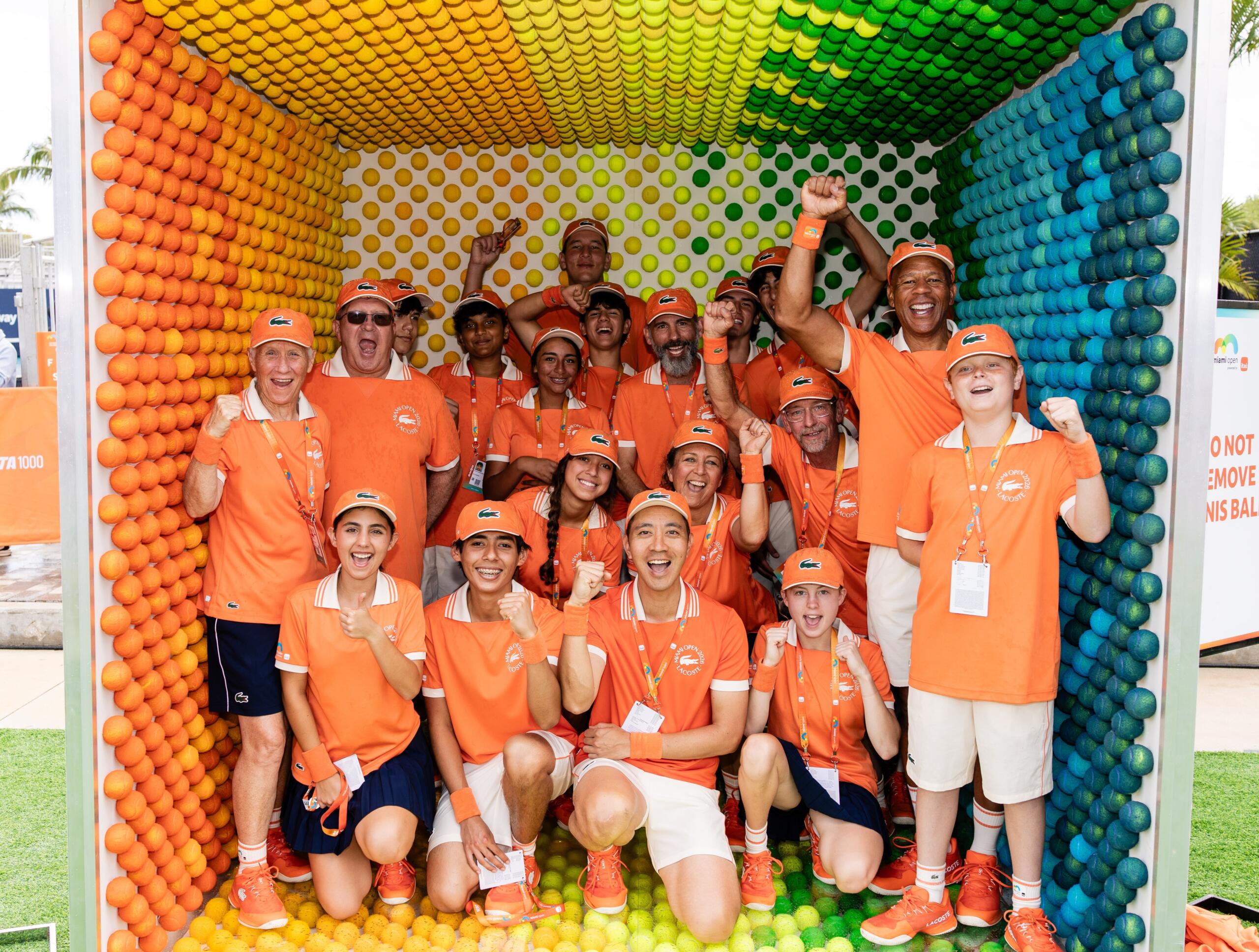 Ballperson's pose and cheer together for a photo shoot.