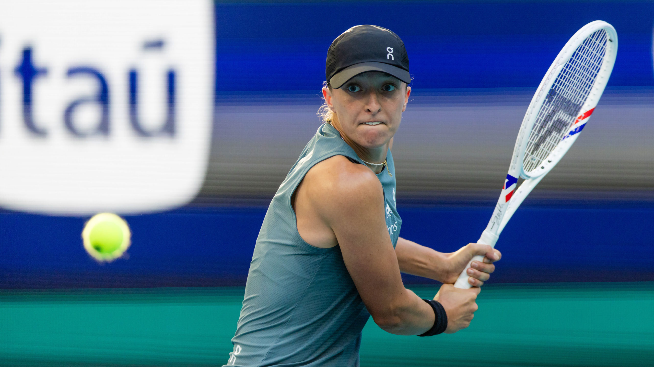 2026 Miami Open, 20260319, Hard Rock Stadium court, Miami Open, RM1L8075, Raul Maristany, Tennis, action, match, returns the ball, Iga Swiatek