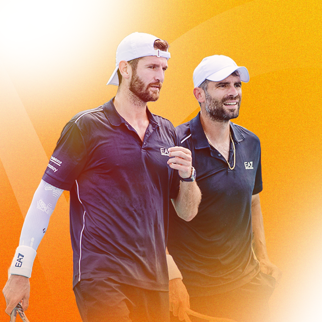 2026 Miami Open men's doubles champions Simonec Bolelli & Andrea Vavassori smile while holding their trophy together.