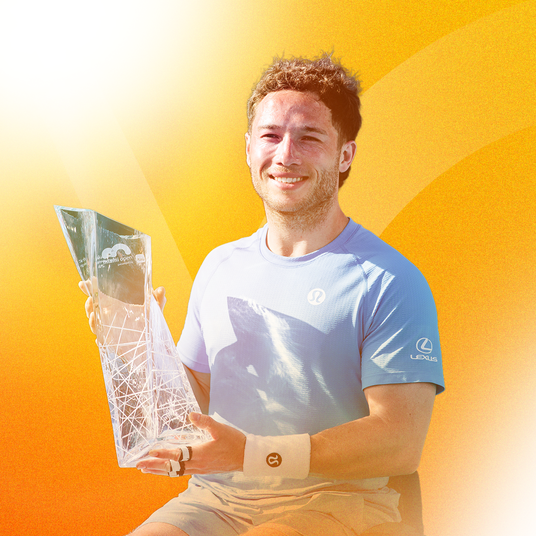 2025 Miami Open men's singles champion Jakub Mensik kisses his trophy after his victory.