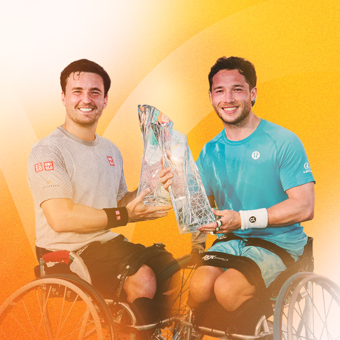 2026 Miami Open men's doubles champions Simonec Bolelli & Andrea Vavassori smile while holding their trophy together.