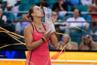 Danielle Collins smiles with her trophy after winning at the 2024 Miami Open.